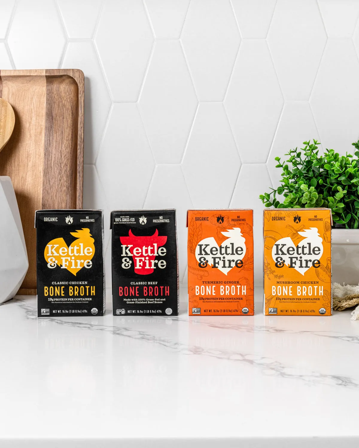 Kettle & Fire cartons lined up on a white kitchen counter