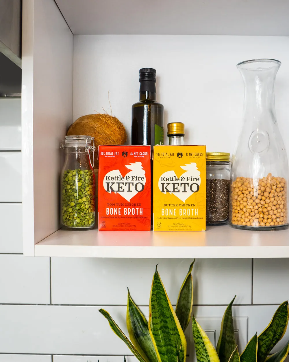Kettle & Fire cartons on an open kitchen shelf